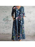 Lumina Wear Polly retro maxi dress with vibrant multi-colored floral patterns, featuring red and blue hues, sleeveless design.