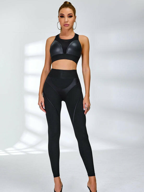 Black PU fishnet breathable sports bra by Lumina Vancouver, featuring a stylish fishnet design and supportive fit for active wear.