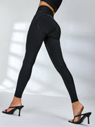 Black PU fishnet breathable sports bra by Lumina Vancouver, featuring a stylish fishnet design for active wear.