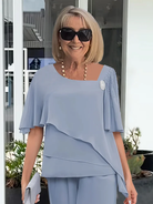 Light blue women's floral print two-piece set by Lumina Wear, featuring elegant style and flattering silhouettes.
