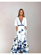 Red floral maxi dress by Lumina Vancouver, Rachel style, with flowing fabric and vibrant flower print.