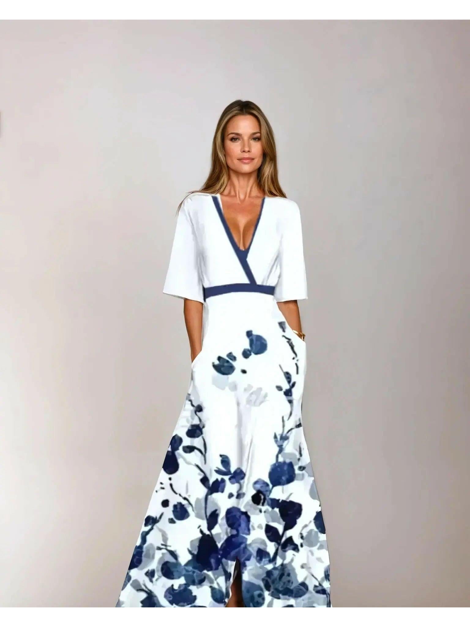 Red floral maxi dress by Lumina Vancouver, Rachel style, with flowing fabric and vibrant flower print.