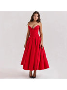 Red Adaline strapless pleated midi dress by Lumina Vancouver, showcasing a sleek design and elegant pleated details.