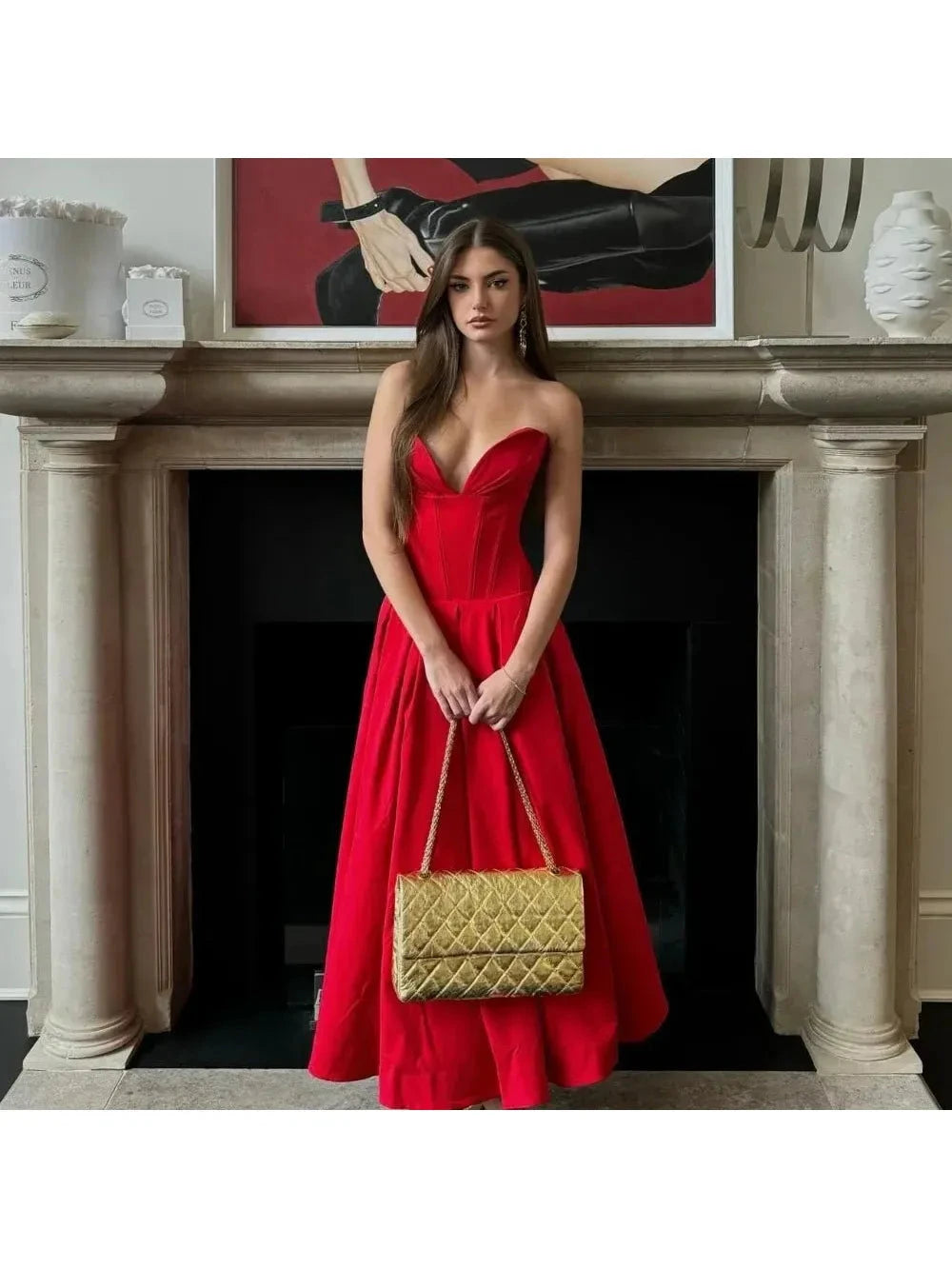 Red Adaline strapless pleated midi dress by Lumina Vancouver, showcasing a sleek design and elegant pleated fabric.