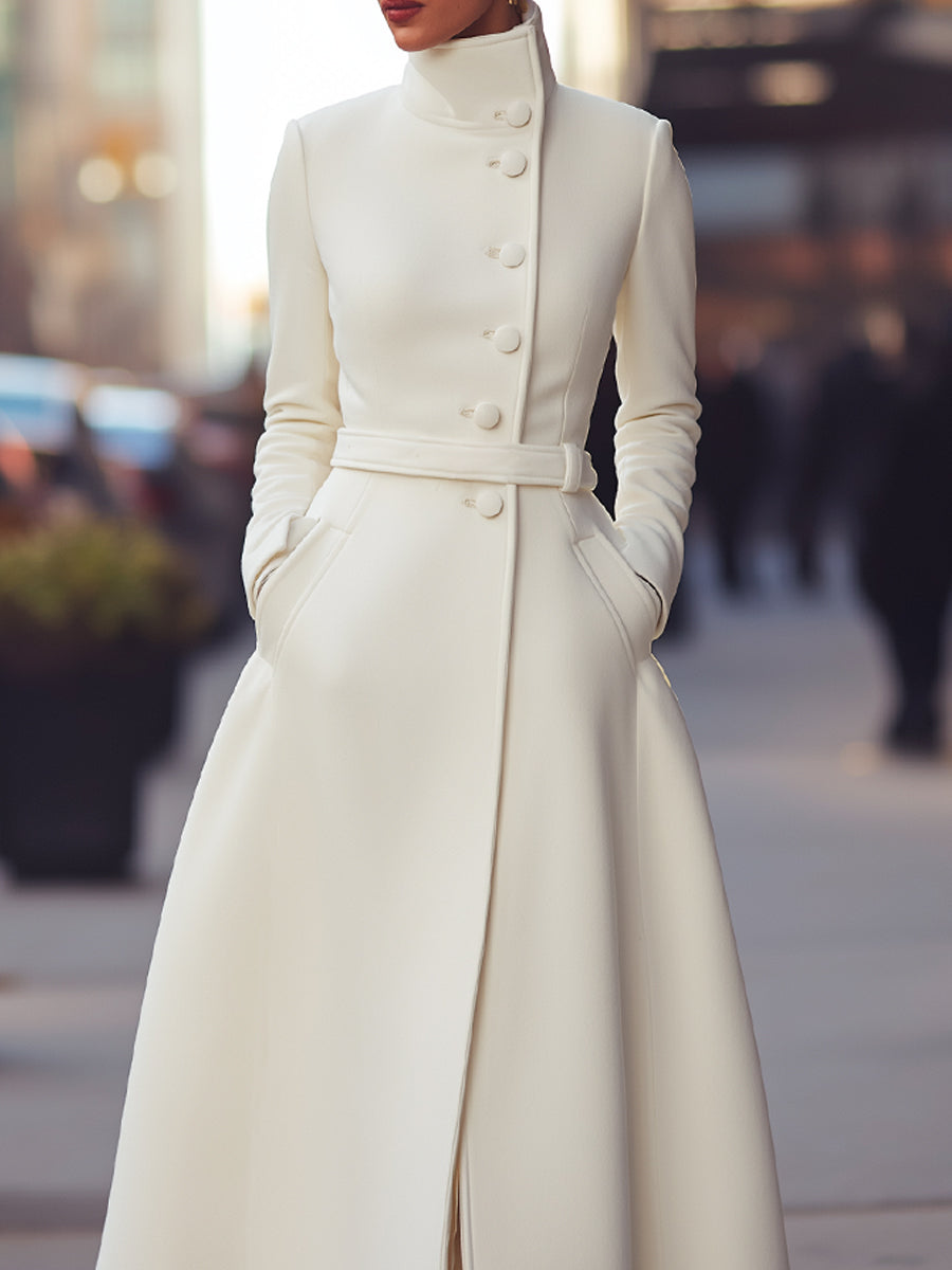 White Regina military-inspired wool coat by Lumina Vancouver shown on a model, featuring structured design and classic details.