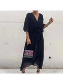 Black Remi loose dress by Lumina Wear, elegant and flowy for casual or formal occasions, shown on a model.