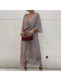 Black Remi loose dress by Lumina Wear, featuring an elegant, flowing silhouette and stylish design for versatile wear.