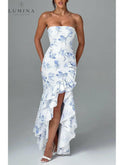 Blue floral sleeveless maxi dress with slit and ruffle details by Lumina Wear, perfect for summer or wedding guest attire.