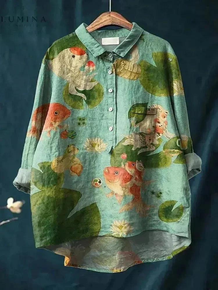 Green Rosa Fish Print Tee by Lumina Vancouver featuring a vibrant fish pattern on soft fabric.