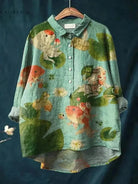 Green Rosa Fish Print Tee by Lumina Vancouver featuring a vibrant fish pattern on soft fabric.