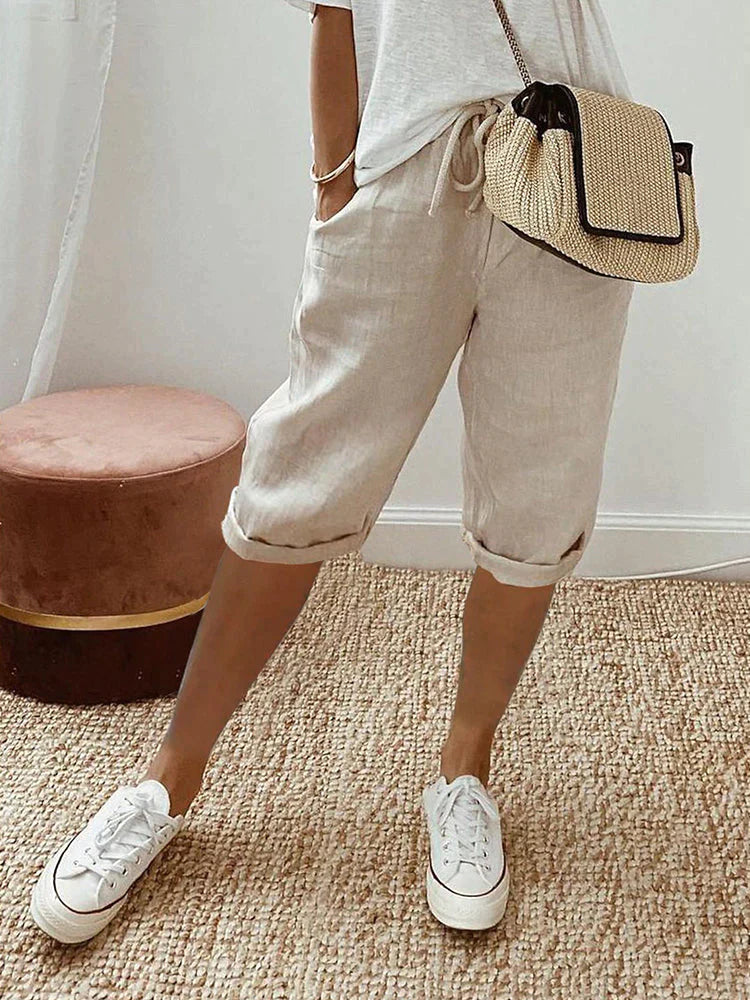 Rosa beige linen blend shorts with adjustable waist from Lumina Wear, relaxed fit, featuring a casual style and green accents.