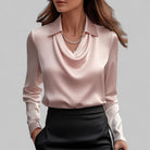 White women's blouse by Lumina Wear featuring an elegant draped neckline and long sleeves, perfect for sophisticated style.