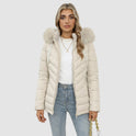 Black Lumina Wear Ruby cozy quilted puffer jacket with faux-fur hood, designed for women, shown on a model.