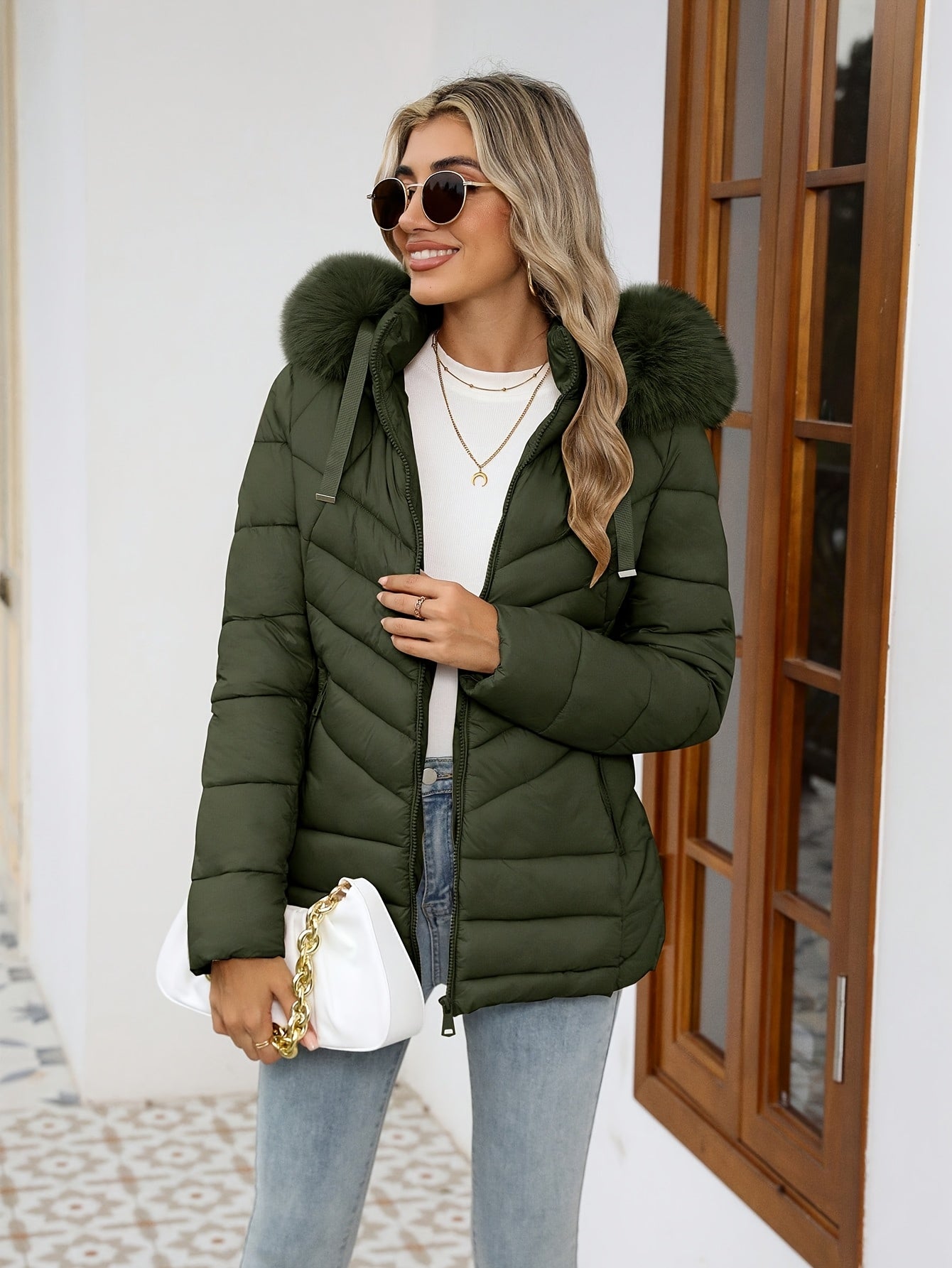 Black Ruby cozy quilted puffer jacket with faux-fur hood from Lumina Wear, designed for women, featuring a warm, padded style.