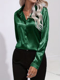 Blue Sarah Lumina Wear elegant button-down blouse with long sleeves, stylish and fitted for a sophisticated look.
