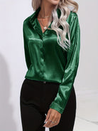 Blue Sarah Lumina Wear elegant button-down blouse with long sleeves, shown on a mannequin, in size XS.