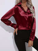 Light blue Sarah Lumina Wear elegant button-down blouse with long sleeves, shown on a model.