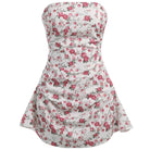 Pink satin strapless mini dress by Lumina Vancouver, shown on a model, fitted bodice with a smooth, shiny finish.
