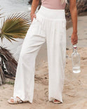White wide-leg breathable pants with elastic waist from Lumina Wear’s Serena collection, shown in XS size.