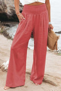 Lumina Wear Serena breathable white wide-leg trousers with elastic waist, shown in a relaxed fit with flowing fabric.