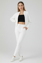 White Serena Lumina Wear lounge set with casual chic style and modern zipper details, featuring a relaxed fit and comfortable fabric.