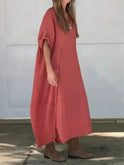 Lumina Wear Francoise casual sand-colored maxi dress, one-color design, flowing fabric, worn by a model outdoors.