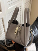 Coffee brown Lumina Wear Serena chic retro crossbody handbag with versatile design, featuring stylish details and compact shape.