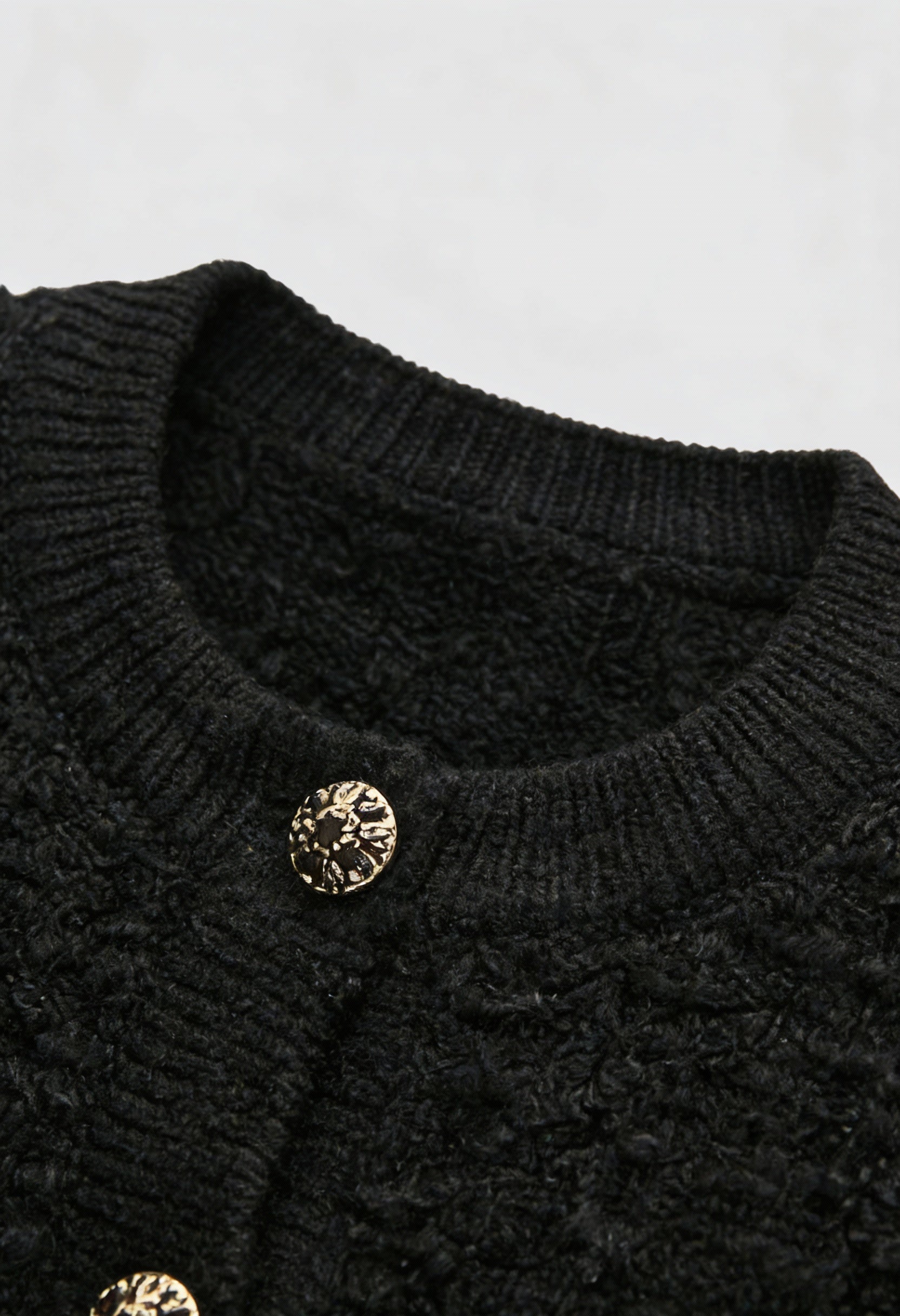 Black knit cardigan with open front by Lumina Wear, styled for women, featuring a cozy and relaxed fit.