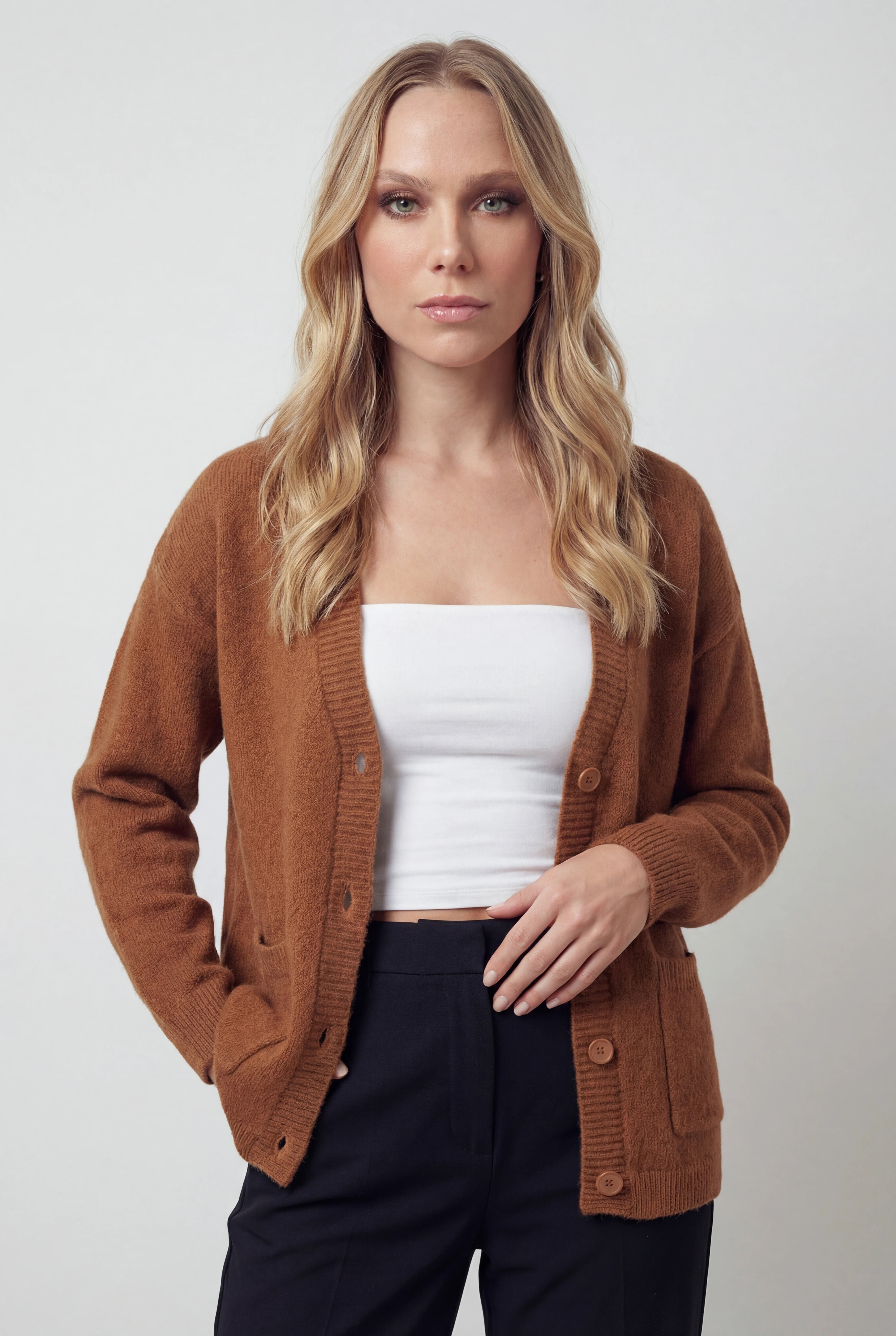 Women’s cozy brown knit cardigan by Lumina Wear, Serena relaxed fit with long sleeves and front pockets.