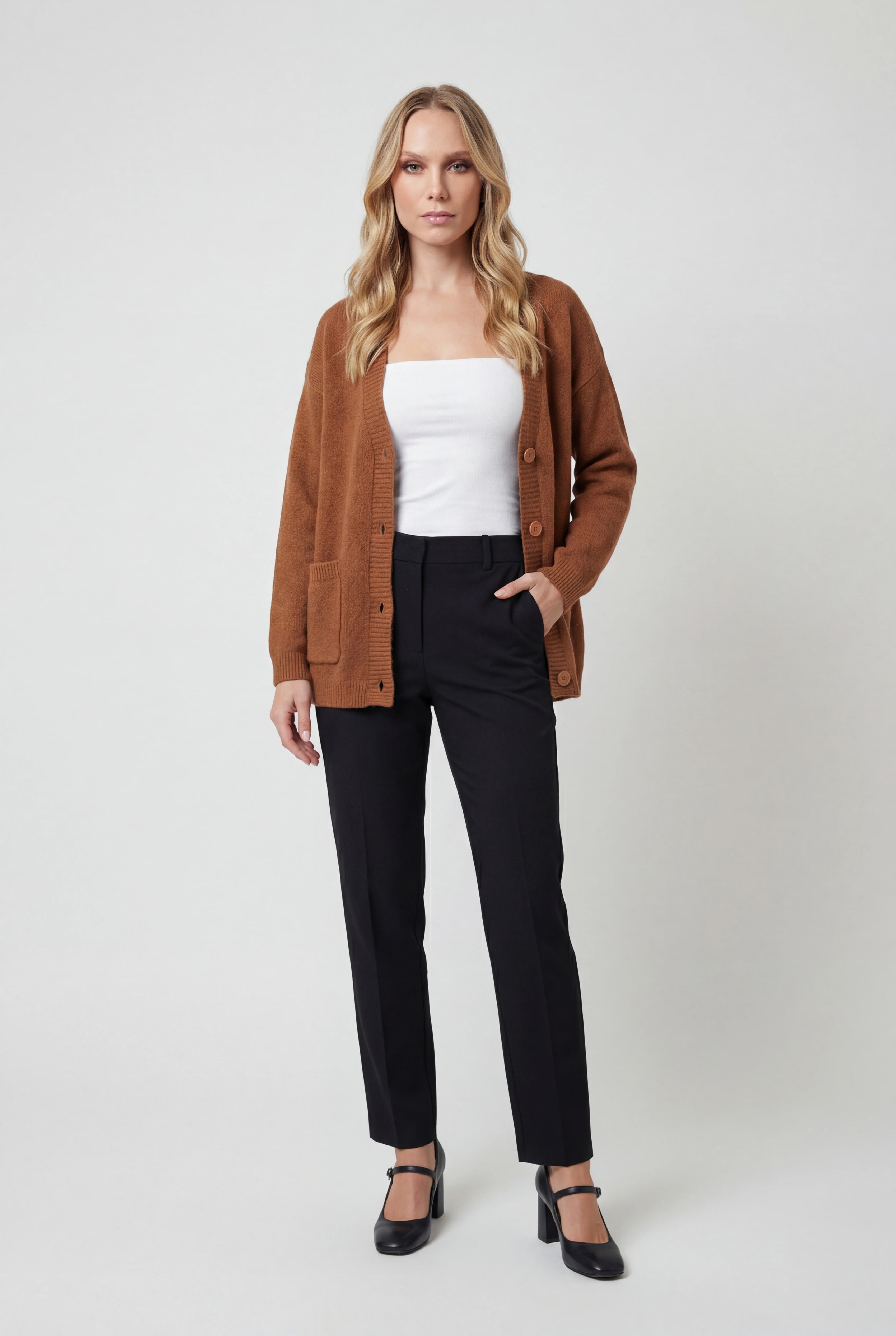 Women’s cozy brown knit cardigan by Lumina Wear with relaxed fit, featuring soft, textured fabric and casual style.