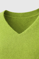 Light green Lumina Wear Serena V-neck women's sweater with a cozy fit, featuring a flattering silhouette and soft knit texture.