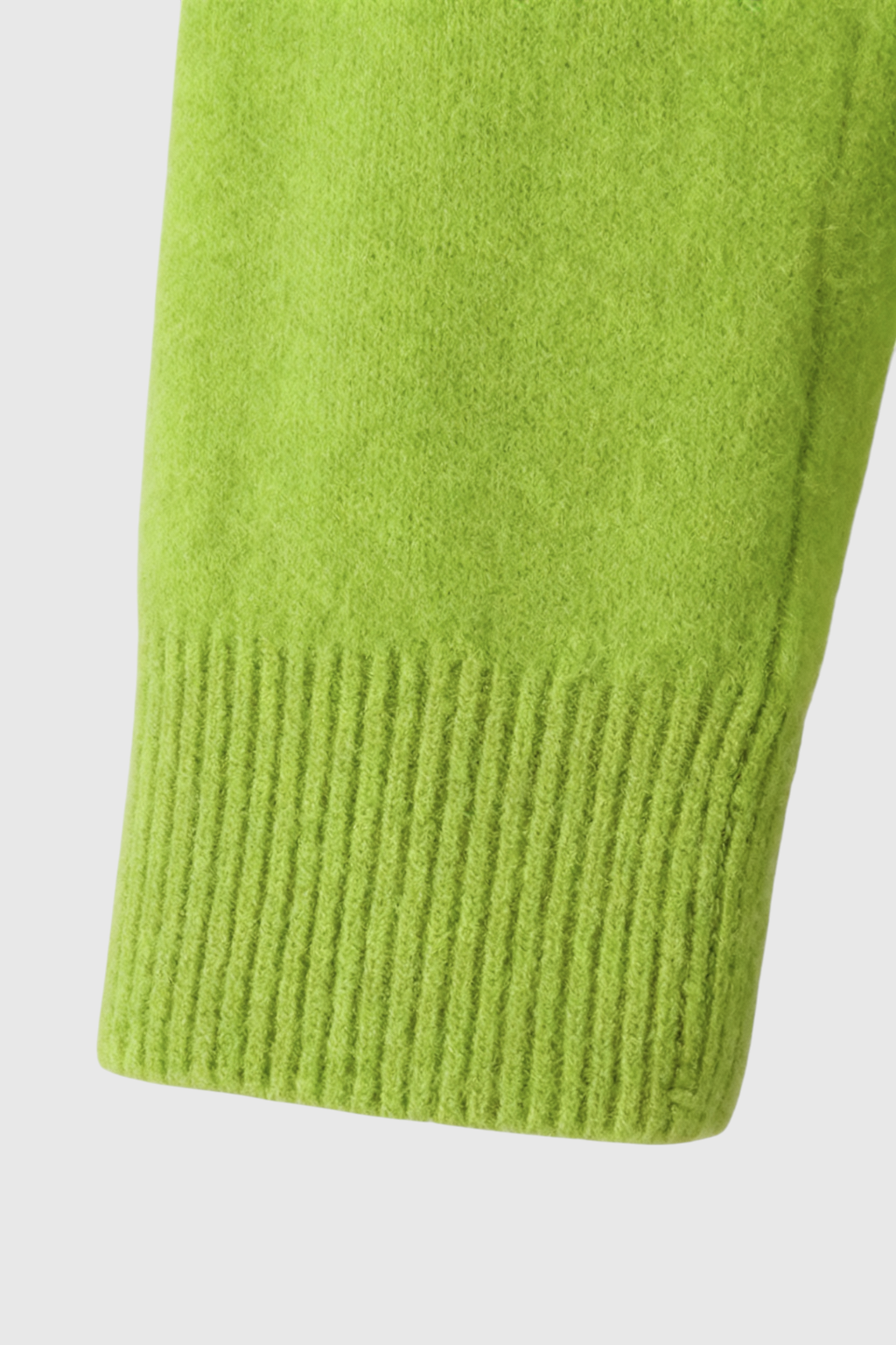 Light green Lumina Wear Serena women's V-neck sweater with a cozy fit, featuring a flattering silhouette and soft knit texture.