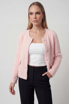 Pink long cardigan sweater with open front from Lumina Wear, styled casually with soft, cozy fabric and a relaxed fit.