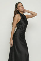 Elegant black maxi dress by Lumina Wear, featuring a flattering silhouette and flowing fabric, perfect for formal occasions.