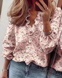 Blue Serena Lumina Wear blouse with elegant ruffle details and V-neck, showcasing a stylish and feminine design.