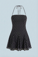 Serena black flared mini dress with polka dot print by Lumina Wear, featuring a fitted bodice and playful style.