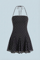 Serena Lumina black flared mini dress with polka dot print, showcasing a stylish and playful dress design.