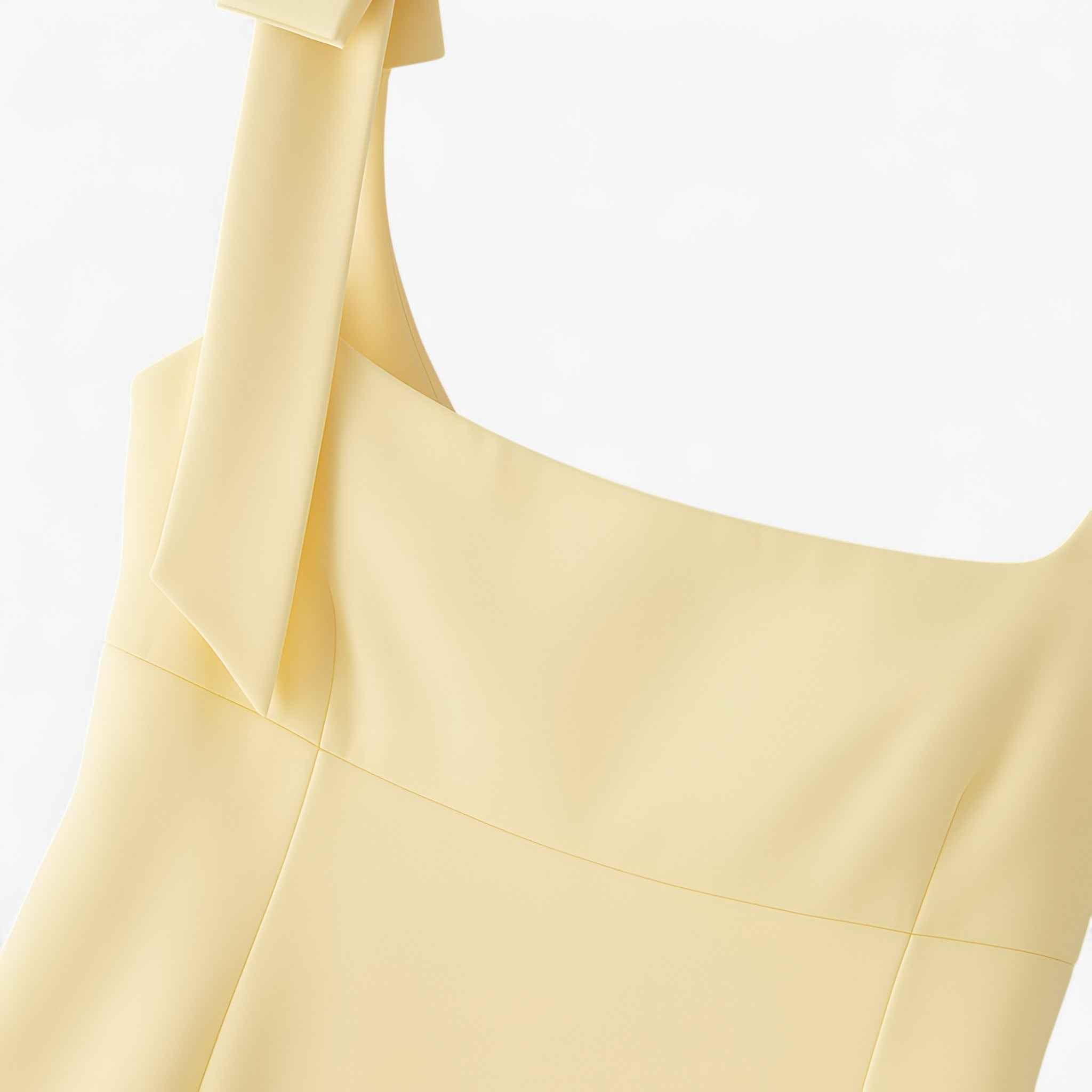 Yellow slim fit camisole tank top with bow detail by Lumina Wear, featuring a playful and stylish design.
