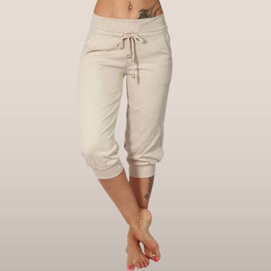 Trendy grey Capri trousers with elastic waistband from Lumina Wear, casual fit, comfortable stretch fabric, styled on a model.