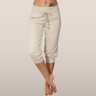 Trendy grey Capri trousers with elastic waistband from Lumina Wear, casual fit, comfortable stretch fabric, styled on a model.