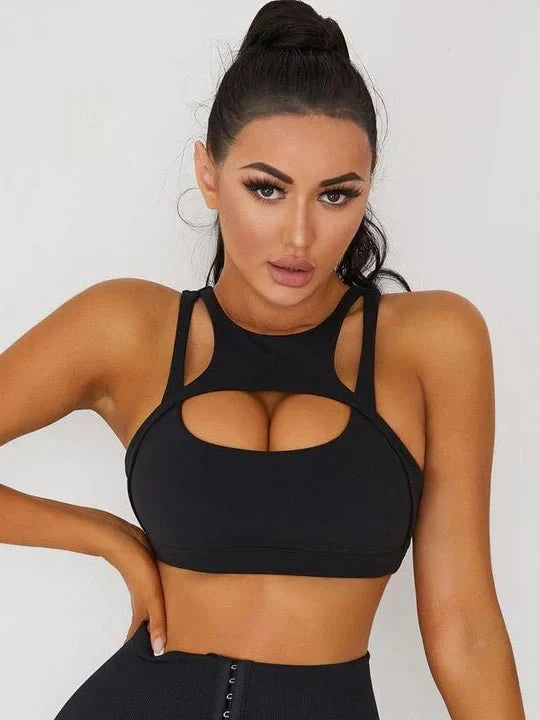 White Lumina Vancouver sexy cutout sports bra featuring stylish cutouts and supportive design for active wear.