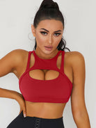White Lumina Vancouver sexy cutout sports bra showing stylish cutout design and supportive fit for active wear.