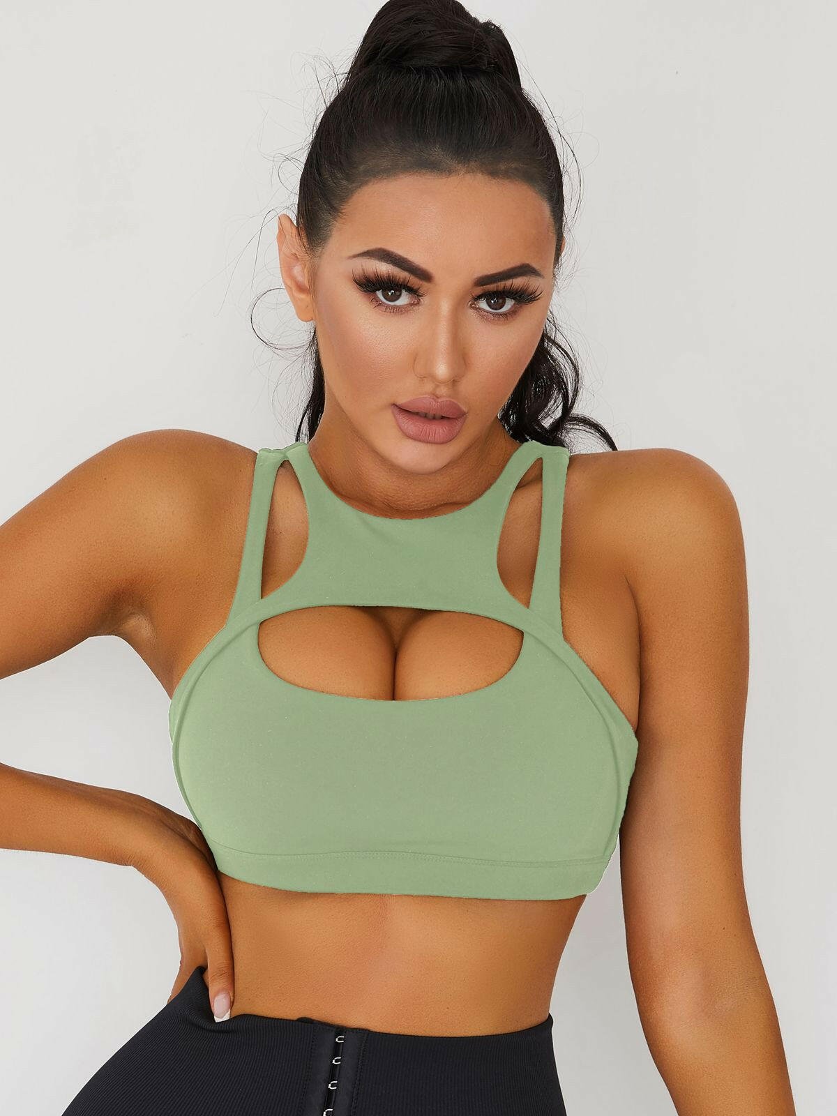 White Lumina Vancouver sexy cutout sports bra with stylish design and supportive fit, perfect for active wear.