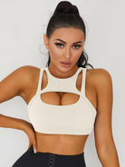 White Lumina Vancouver sexy cutout sports bra, athletic sports bra with stylish cutouts and supportive fit for active wear.
