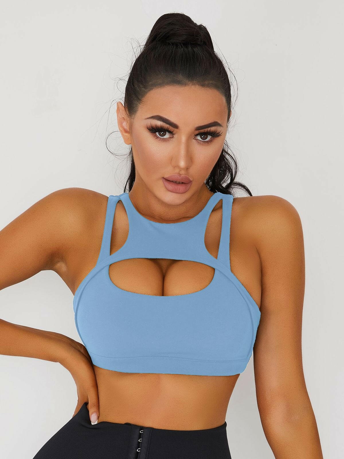 White Lumina Vancouver sexy cutout sports bra showing stylish design and supportive fit for active wear.