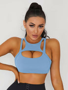 White Lumina Vancouver sexy cutout sports bra showing stylish design and supportive fit for active wear.