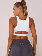 White Lumina Vancouver sexy cutout sports bra with stylish design and supportive fit, ideal for active wear and workouts.