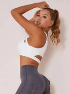 White Lumina Vancouver sexy cutout sports bra with stylish design and supportive fit, ideal for active wear and workouts.