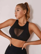 Black patchwork sports bra by Lumina Vancouver, featuring a stylish design perfect for active wear.