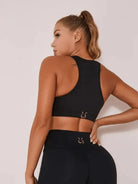 Black Lumina Vancouver patchwork sports bra with stylish design, featuring supportive straps and a comfortable fit for active wear.